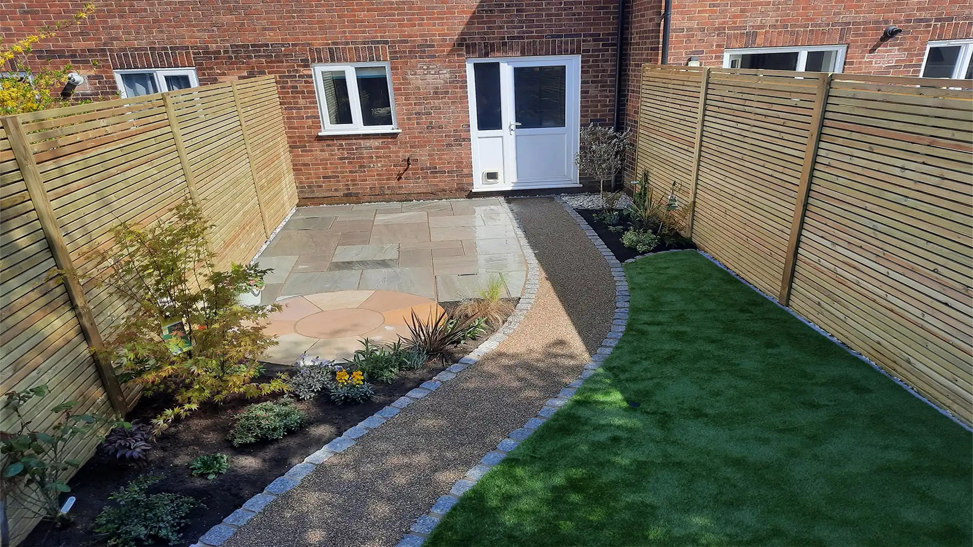 New fence alongside garden patio